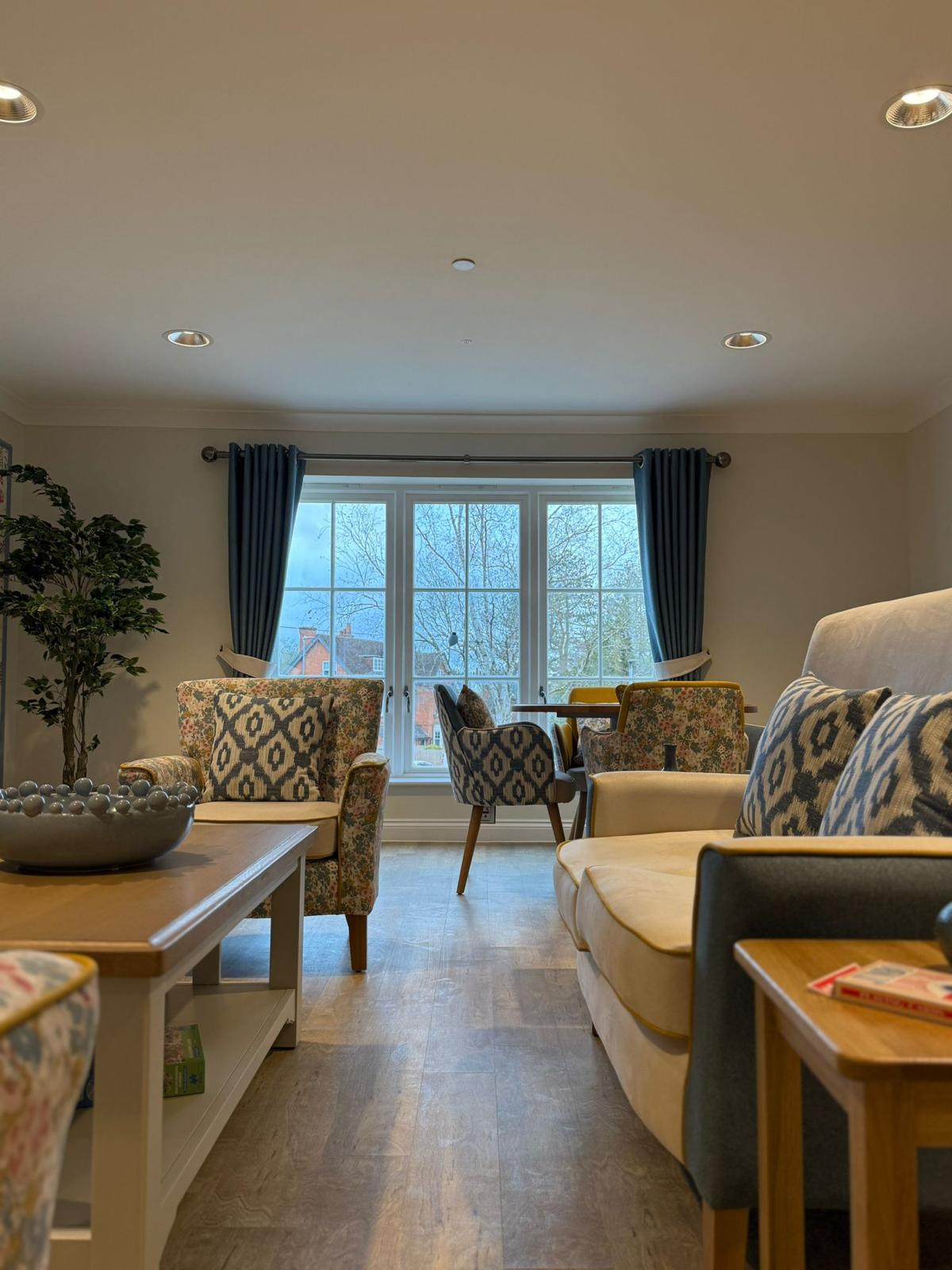 Bright lounge with bay windows at Oadby Manor